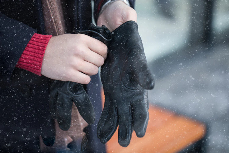 a_man_wearing_heated_gloves_in_winter_