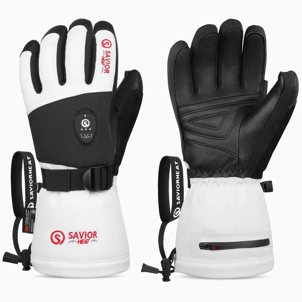 SAVIORHEAT heated gear for winter outdoor adventures on a snowy mountain at sunrise. 